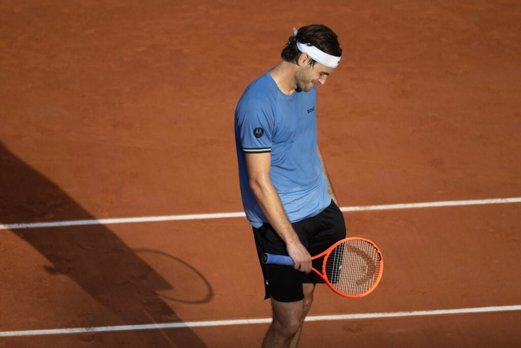 Sam Querrey reacts after Taylor Fritz loses in the first round of the French Open 