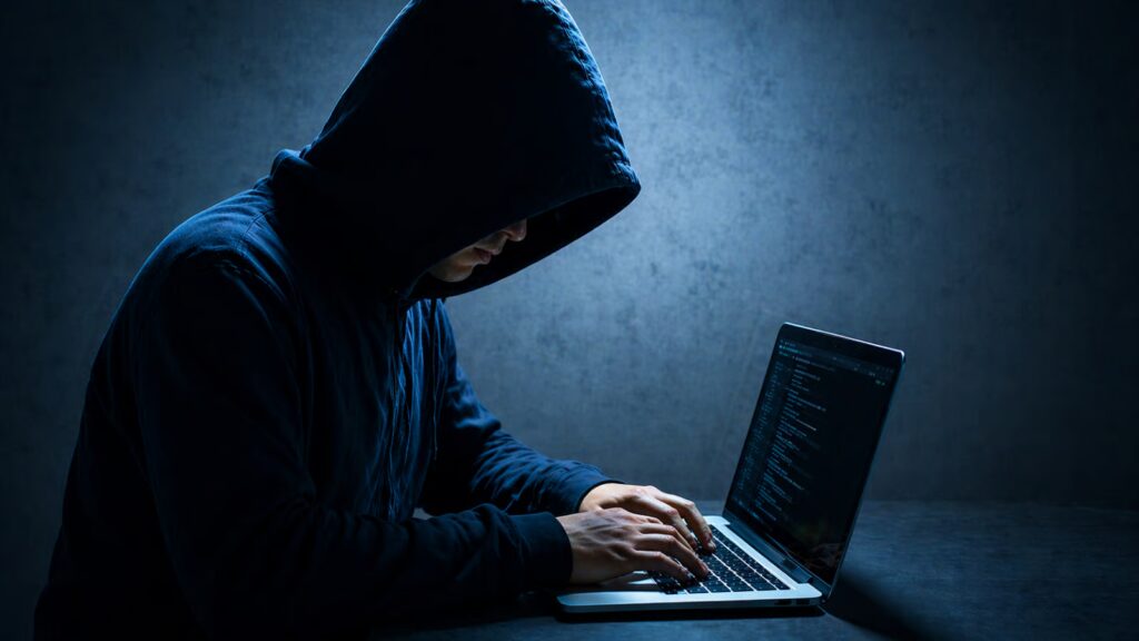 hacker on laptop