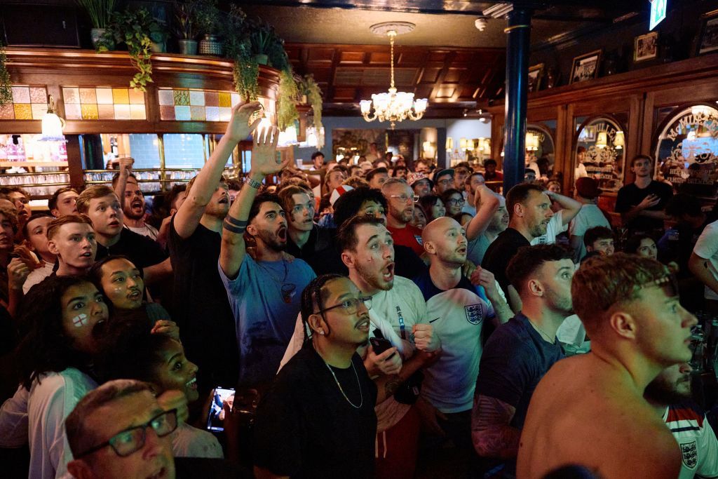 Will pubs stay open for England vs Mexico? England fans celebrate their team's goal as they watch a live screening of the UEFA Euro 2024 final football match between Spain and England being played in Berlin, inside a pub in central London on July 14, 2024. England are hoping to end their 58-year wait to win a men's major international tournament when they take on an outstanding Spain team in the final of Euro 2024.