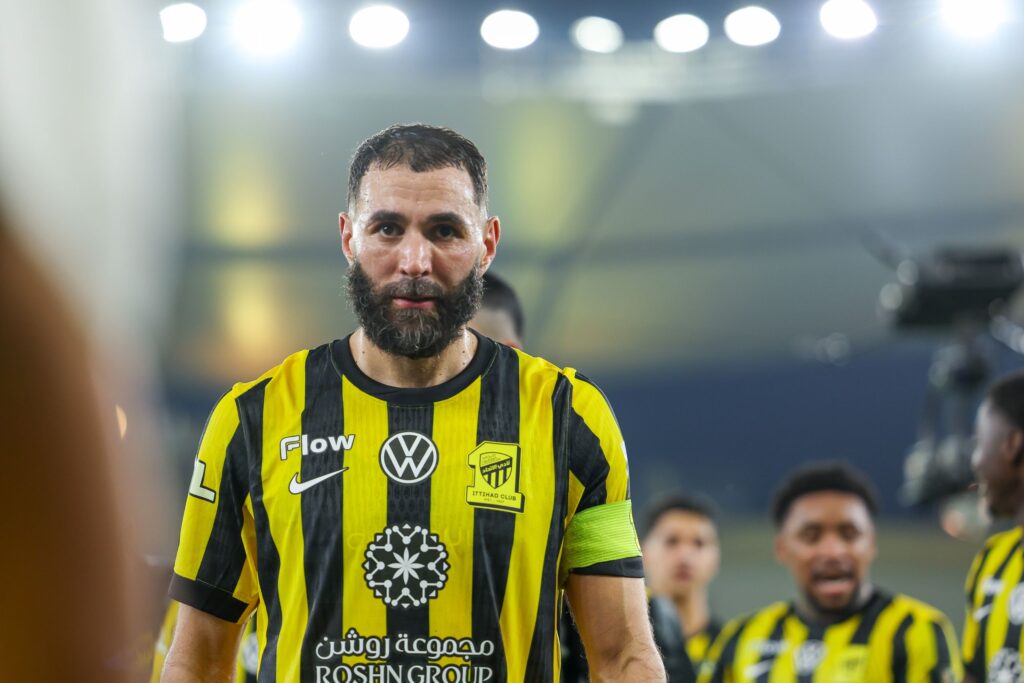 Current free transfer Karim Benzema walking down the tunnel in an Al-Ittihad kit.